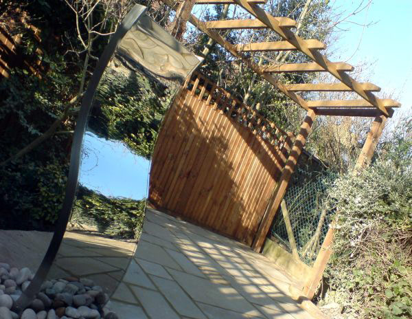 garden design by Bizzy in the Garden mirror and wooden fencing